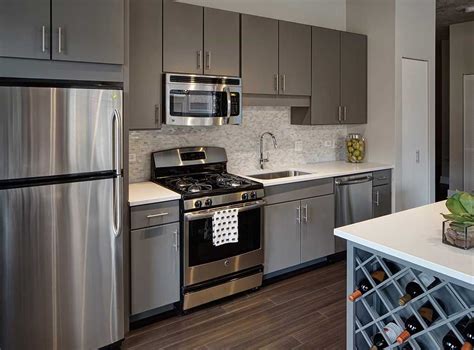 gray kitchen cabinets with stainless steel appliances pine backsplash|light grey kitchen cabinets.